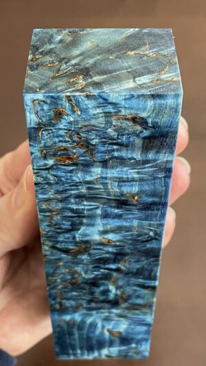 Blue colored and stabilized karelian birch block.